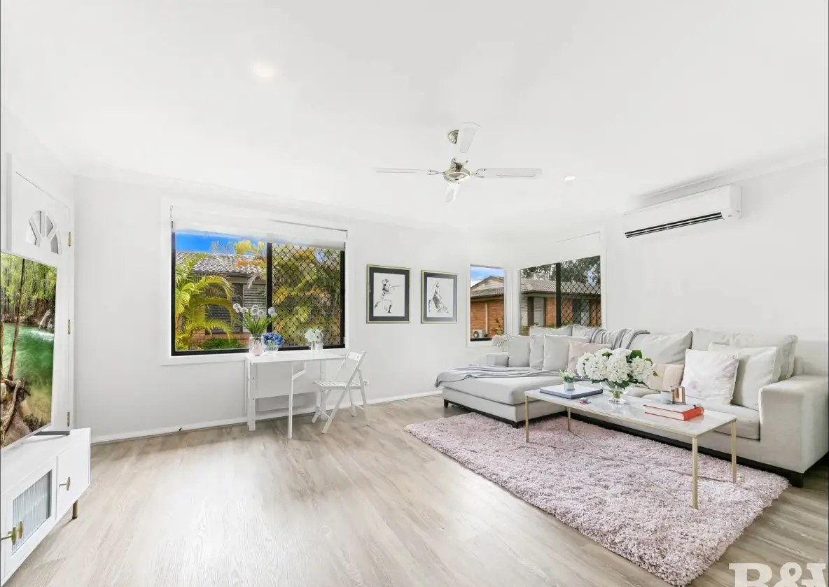 Bright family living room styled in soft whites and pale timbers